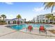 Resort-style pool with lounge chairs at 4721 Clock Tower Dr # 204, Kissimmee, FL 34746