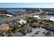 Aerial view of complex with lake and roadway nearby at 505 Polaris Loop # 107, Casselberry, FL 32707