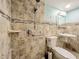 Accessible bathroom with walk-in shower, grab bars, and tile at 505 Polaris Loop # 107, Casselberry, FL 32707