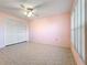 Bedroom with ceiling fan, tile floors and mirrored closet doors at 505 Polaris Loop # 107, Casselberry, FL 32707