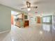 Spacious living room with tile floors and a ceiling fan at 505 Polaris Loop # 107, Casselberry, FL 32707