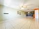 Spacious living room with tile floors and ceiling fan at 505 Polaris Loop # 107, Casselberry, FL 32707