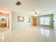 Living room with tile floors, a ceiling fan, and view of bathroom at 505 Polaris Loop # 107, Casselberry, FL 32707