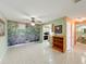 Living room with tile floors, ceiling fan, and garden mural at 505 Polaris Loop # 107, Casselberry, FL 32707
