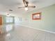 Living room with tile floors and ceiling fan; view of exterior at 505 Polaris Loop # 107, Casselberry, FL 32707