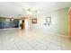 Spacious living room with tile floors and ceiling fan at 505 Polaris Loop # 107, Casselberry, FL 32707
