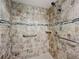 Large walk-in shower with grab bars and tile surround at 505 Polaris Loop # 107, Casselberry, FL 32707