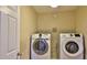 Bright laundry room with washer and dryer at 5344 Peach Blossom Blvd, Port Orange, FL 32128