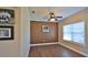 Bright home office features hardwood floors, large window, and decorative wall at 5344 Peach Blossom Blvd, Port Orange, FL 32128