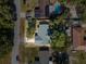 Aerial view of a single-Gathering home with a green roof at 5851 Edouard St, Oviedo, FL 32765