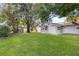 Spacious backyard with a detached shed and mature trees at 5851 Edouard St, Oviedo, FL 32765