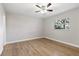 Spacious bedroom with hardwood floors and a ceiling fan at 5851 Edouard St, Oviedo, FL 32765