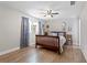 Spacious bedroom with hardwood floors and ceiling fan at 5851 Edouard St, Oviedo, FL 32765