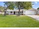 Newly renovated house with a large yard and attached garage at 5851 Edouard St, Oviedo, FL 32765