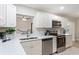 Newly renovated kitchen with white cabinets and stainless steel appliances at 5851 Edouard St, Oviedo, FL 32765