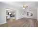 Bright living room with hardwood floors and ceiling fan at 5851 Edouard St, Oviedo, FL 32765