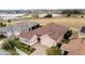 Beautiful aerial view of a house in a desirable neighborhood at 729 Alcove Dr, Groveland, FL 34736