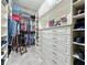 Well-organized walk-in closet with custom built-ins at 729 Alcove Dr, Groveland, FL 34736