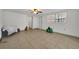 Spacious common area with tile flooring and ceiling fan at 7675 Nolton Way, Orlando, FL 32822