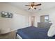 Bedroom with ample closet space and a TV mounted on the wall at 8942 Cabot Cliffs Dr, Davenport, FL 33896
