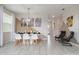 Dining area with modern decor, two-toned wall, and view towards front door at 8942 Cabot Cliffs Dr, Davenport, FL 33896