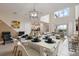Dining area with white and black dinnerware setup and open view of the living area at 8942 Cabot Cliffs Dr, Davenport, FL 33896