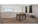 Upstairs game room with foosball table, window with community view, and neutral decor at 8942 Cabot Cliffs Dr, Davenport, FL 33896