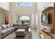 View of the living room with access to screened patio overlooking a pool at 8942 Cabot Cliffs Dr, Davenport, FL 33896