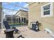 Pool and patio area with safety fence, grill, and seating at 8942 Cabot Cliffs Dr, Davenport, FL 33896