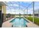 Inviting pool with a safety fence and serene water view at 8942 Cabot Cliffs Dr, Davenport, FL 33896
