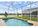 Private pool and screened lanai with a peaceful water view at 8942 Cabot Cliffs Dr, Davenport, FL 33896
