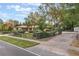 A split rail fence borders the landscaped yard of this single-story home at 1098 Park Dr, Casselberry, FL 32707