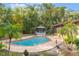 Private pool area surrounded by tropical foliage, offering a serene escape at 1098 Park Dr, Casselberry, FL 32707