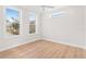 Spacious bedroom with wood floors and natural light at 12071 Lakeshore Way, Oxford, FL 34484