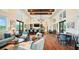 Relaxing clubhouse with seating areas and a bar at 12071 Lakeshore Way, Oxford, FL 34484