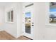 White door with glass panel leading to outdoor patio at 12071 Lakeshore Way, Oxford, FL 34484