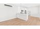 Modern white kitchen with stainless steel appliances at 12071 Lakeshore Way, Oxford, FL 34484