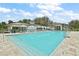 Resort-style pool with lounge chairs and umbrellas at 12071 Lakeshore Way, Oxford, FL 34484