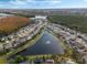 Aerial view of a community with lakefront homes at 1515 Cedar Lake Dr, Orlando, FL 32824