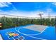 Private outdoor basketball court with colorful design at 165 Golden Noble St, Kissimmee, FL 34747