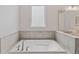 Bathroom with soaking tub and window at 165 Golden Noble St, Kissimmee, FL 34747