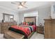 Comfortable bedroom featuring wooden furniture and neutral decor at 2069 Canton Park Dr, Winter Haven, FL 33881