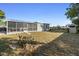 Backyard view of house, fence, and storage building at 2310 Fairgren Ave, Deltona, FL 32738