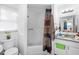 Bathroom with shower/tub, granite countertop, and mirror at 2310 Fairgren Ave, Deltona, FL 32738