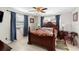 Bedroom with a wooden bed frame and ceiling fan at 2310 Fairgren Ave, Deltona, FL 32738