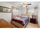 Light and airy bedroom with a double bed and wood flooring at 2310 Fairgren Ave, Deltona, FL 32738