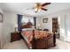 Bedroom with wooden frame bed and ensuite bathroom at 2310 Fairgren Ave, Deltona, FL 32738
