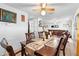 Dining room with wood table and chairs, view into living room at 2310 Fairgren Ave, Deltona, FL 32738