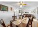 Dining area with wood table and chairs, view into living room at 2310 Fairgren Ave, Deltona, FL 32738