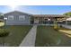 Gray single-story house with landscaped lawn and walkway at 2310 Fairgren Ave, Deltona, FL 32738